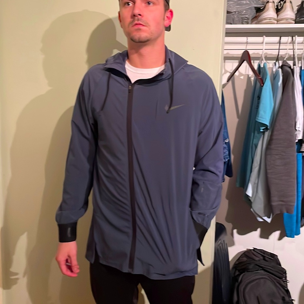 Nike Dry Fit Runner. New and crisp. Clean zip up with hoody.
